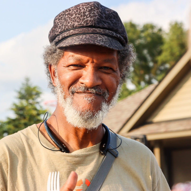 Man in hat facing camera