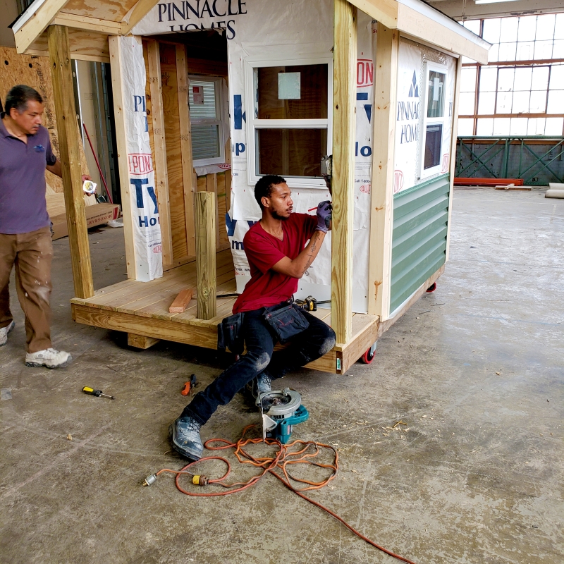 Man working on a shed house