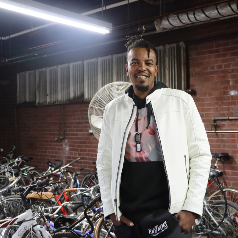 Young man in bike shop